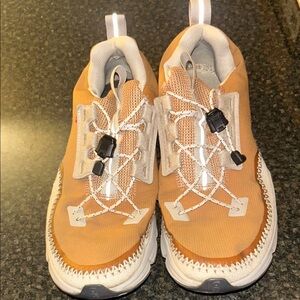On Running Athletic Shoes in Orange and White